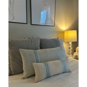 Custom Pillows off white and gray undertones fabric with blue color trim